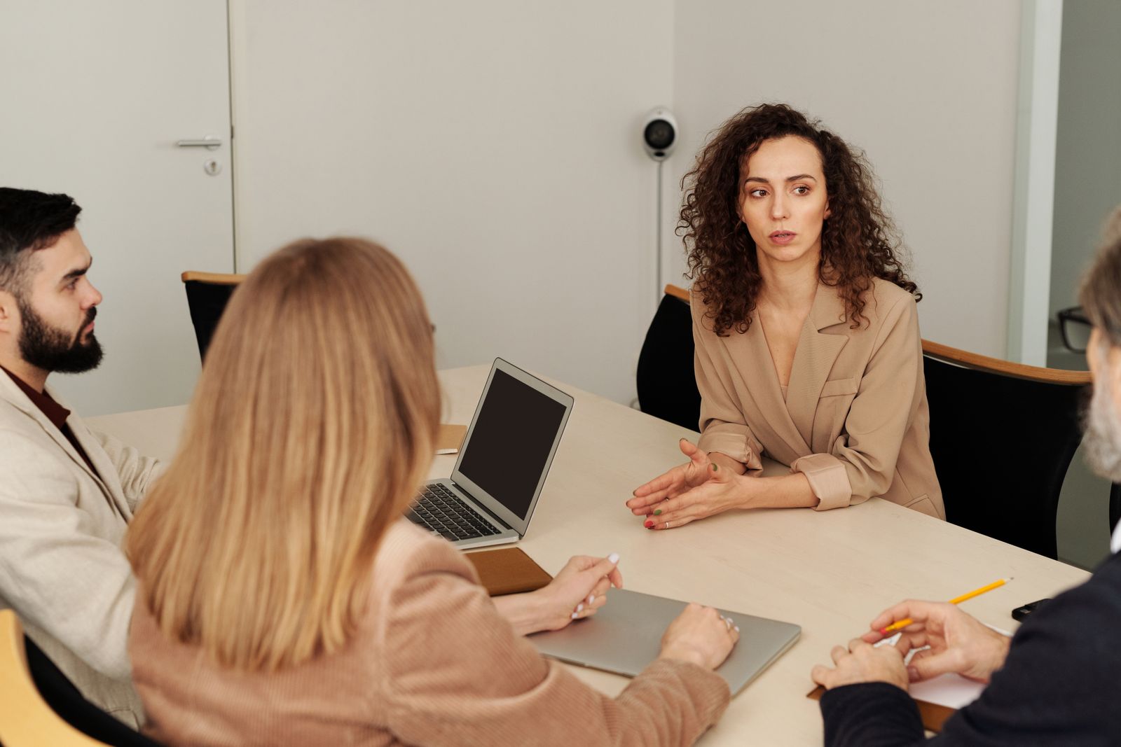 Business professionals reviewing documents together in a bright office